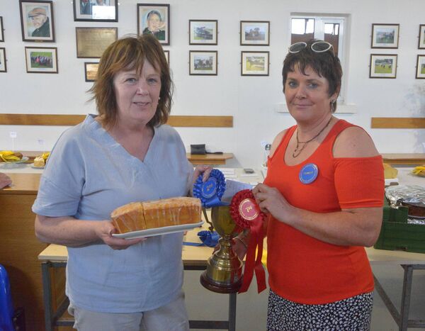Margaret O'Hara from Bonniconlon, left, overall winner in the cookery section at the Ballinrobe Show. Presenting the cup is Breege Morrin (steward).