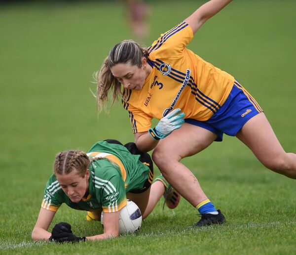 Kilmovee's Leah McHugh hits the deck under pressure from Knockmore defender Roisin Flynn. Kilmovee's Leah McHugh hits the deck under pressure from Knockmore defender Roisin Flynn.