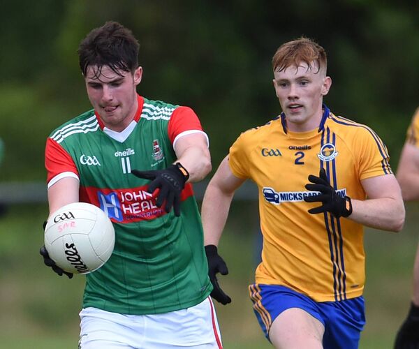 Frank Irwin of Ballina racing clear of Knockmore’s Marcus Park during this season's drawn game in Division 1A of the Mayo SFL.