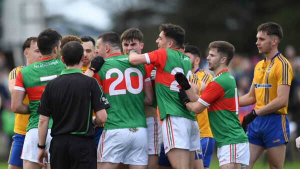 Players from both sides get caught up in an onfield dispute as match referee Jerome Henry tries to calm matters in the final minutes of the Mayo SFC semi-final between Ballina Stephenites and Knockmore.