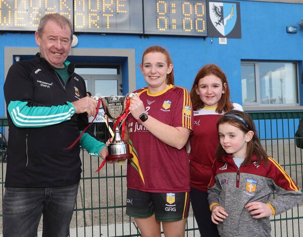 Mayo LGFA chairman Des Phillips presents the LGFA Intermediate Cup to Sinead Kearns, captain of MacHale Rovers, who is pictured with her daughters Lauren and Katelyn Mangan. Mayo LGFA chairman Des Phillips presents the LGFA Intermediate Cup to Sinead Kearns, captain of MacHale Rovers, who is pictured with her daughters Lauren and Katelyn Mangan.