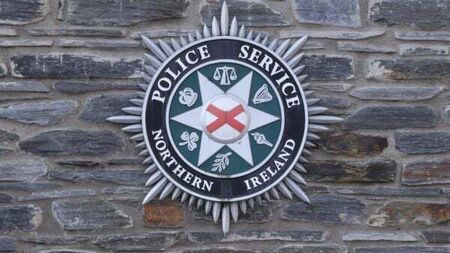 Man arrested over footage appearing to show shots being fired over a coffin