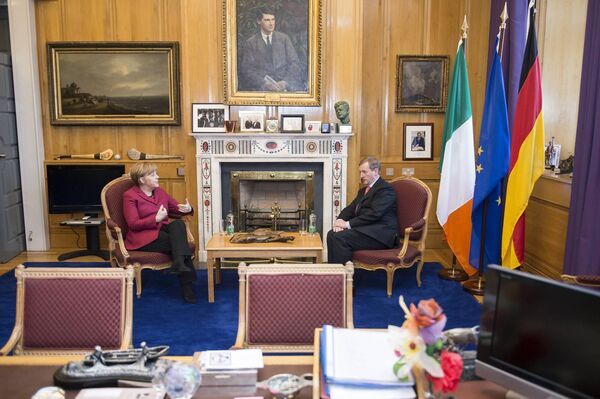 Taoiseach Enda Kenny chats with German Chancellor Angela Merkel on March 7, 2014. The two leaders are pictured in the Taoiseach's office in Government Buildings under a portrait of Michael Collins. Picture: Guido Bergmann/ Bundesregierung via Getty Images Taoiseach Enda Kenny chats with German Chancellor Angela Merkel on March 7, 2014. The two leaders are pictured in the Taoiseach's office in Government Buildings under a portrait of Michael Collins. Picture: Guido Bergmann/ Bundesregierung via Getty Images