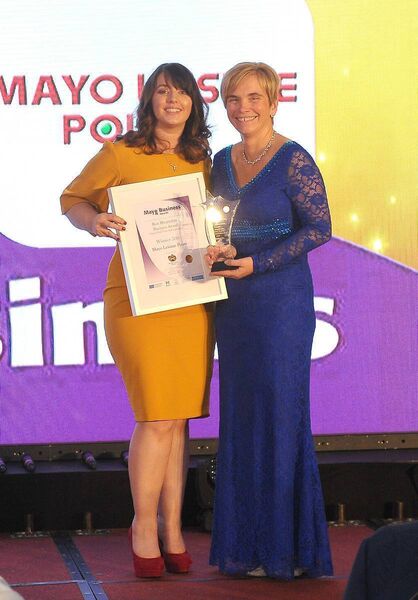 Cora Mulroy (right), on behalf of Mayo Leisure Point, receiving the Best Hospitality Award (Over 10 Full-Time Staff Equivalent) at the Mayo Business Awards in 2018. Sheila Sheeran, Breaffy House Hotel Resort, who sponsored the award, is making the presentation.