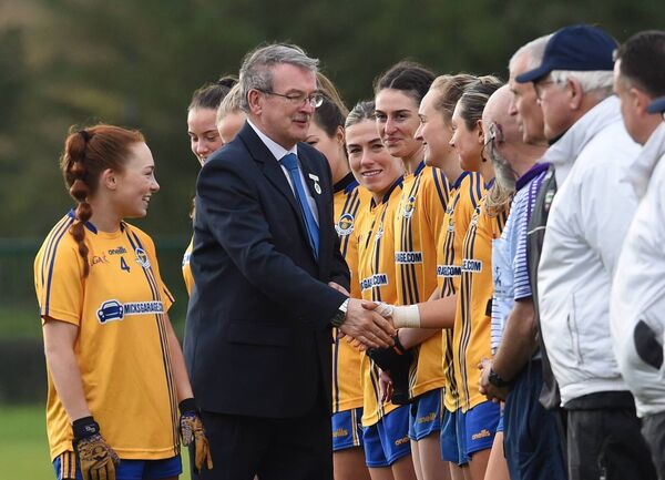 Knockmore captain Nina McVann introduces her team to Connacht LGFA President Con Moynihan, prior to the game.