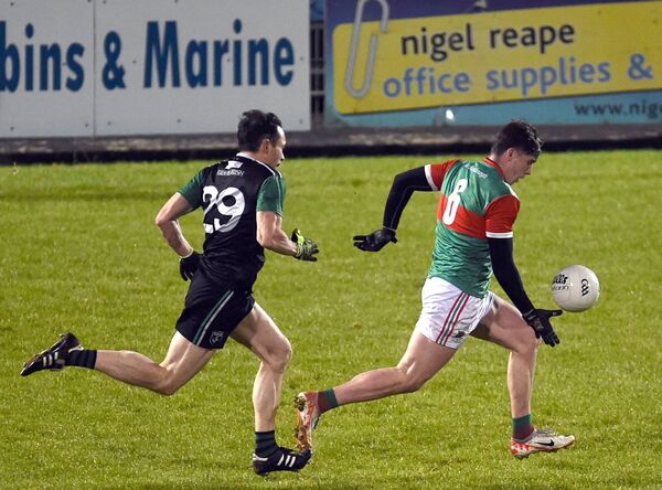 Sam Callinan gives Fulham's Hurl Dockry the slip.	Picture: David Farrell Photography