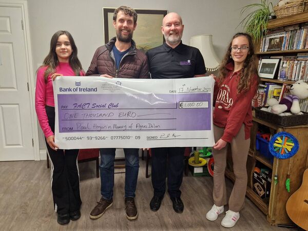 Paul Hogan, Ballina (second from left), who ran the Dublin City Marathon 2023 recently in memory of his late grandmother Agnes Dolan, and donated his funds to the Foxford Alzheimer's and Community Trust Social Club. The organisation supports people with dementia and those who are suffering the effects of rural isolation in Mayo. Paul presented a cheque for €1,000 to Declan Howley, FACT Social Club Manager. Also pictured are Paul’s daughters Aisha and Zoe.