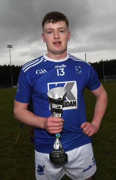 Eoin Delaney, who scored 0-5 from play, with the man-of-the-match trophy. Eoin Delaney, who scored 0-5 from play, with the man-of-the-match trophy.