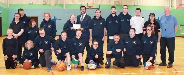 Ballina Special Olympics Basketball Club, winner of the September 2023 Gala Retail Gifts for Clubs prize, is presented with a cheque by David Moran from Gala Retail. Accepting the cheque is the longest-standing member of the Ballina club, Jonathan Knight. Also pictured are club coach, Barry Murphy, and some members of Ballina Special Olympics Basketball Club.  Ballina Special Olympics Basketball Club, winner of the September 2023 Gala Retail Gifts for Clubs prize, is presented with a cheque by David Moran from Gala Retail. Accepting the cheque is the longest-standing member of the Ballina club, Jonathan Knight. Also pictured are club coach, Barry Murphy, and some members of Ballina Special Olympics Basketball Club.