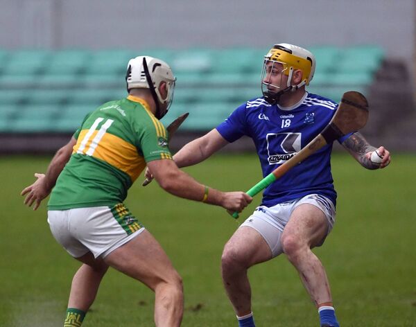 Tooreen’s Gary Nolan looks for a way out of defence past Alan Fenton of Castlelyons. Tooreen’s Gary Nolan looks for a way out of defence past Alan Fenton of Castlelyons.