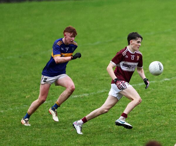 Diarmuid Coggins of Crossmolina skips away from Mayo Gaels defender Enda Jennings.