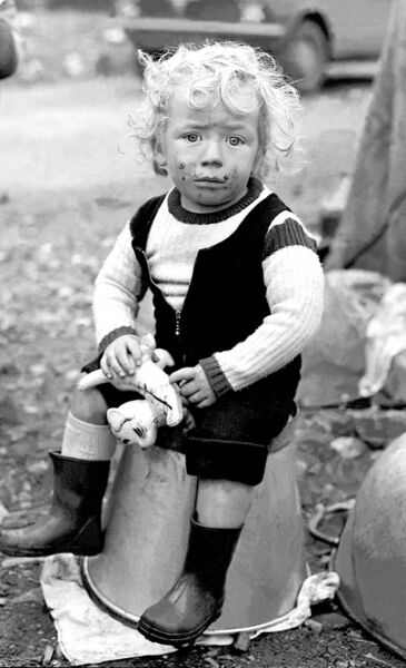 One of my favourites, using strong blacks and subtle shades of grey, is the young boy at a roadside camp. One of my favourites, using strong blacks and subtle shades of grey, is the young boy at a roadside camp.