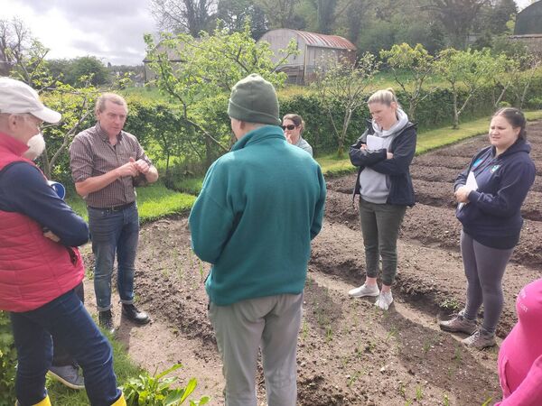 Martin Connor chatting to gardeners at Ballyhaunis Community Garden. Martin Connor chatting to gardeners at Ballyhaunis Community Garden.
