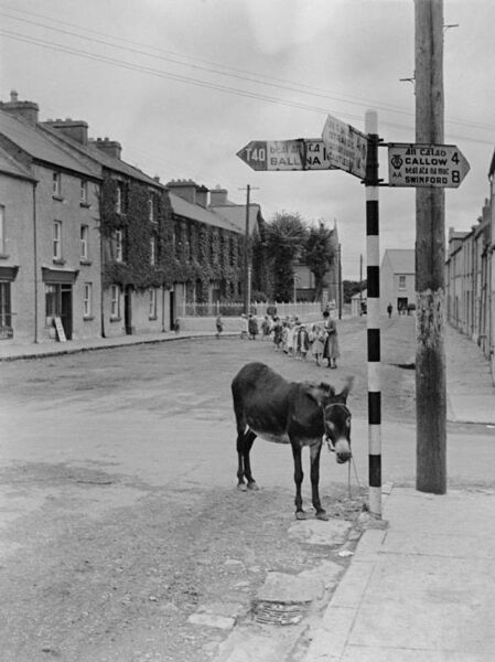 Youngsters crossing the road from Foxford National School in the 1930s with teacher Annie Jones.