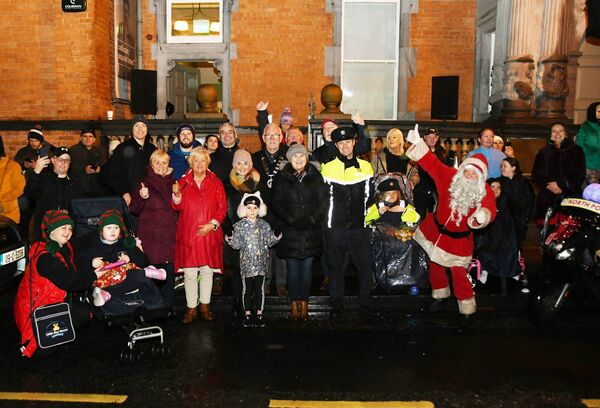 Pictured outside the Jackie Clarke Collection at the official launch of Light Up Winter Magic on Pearse Street in Ballina were Cllr Annie May Reape, Minister Dara Calleary TD, Cllr Seamus Weir (Cathaoirleach Ballina MD), Cllr Michael Loftus (Cathaoirleach, Mayo Co Council), Garda David Reilly and Declan Turnbull, Head of Ballina Municipal District, along with guests. 	Picture: John O'Grady
