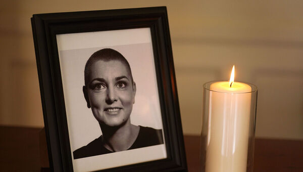 A photo of Sinead O'Connor at the Mansion House in Dublin last July after a book of condolence was opened following her death at the age of 56. Picture: Brian Lawless/PA Wire A photo of Sinead O'Connor at the Mansion House in Dublin last July after a book of condolence was opened following her death at the age of 56. Picture: Brian Lawless/PA Wire