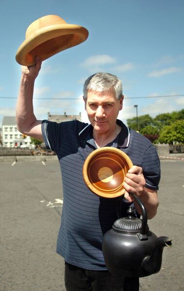 Ballina native Willie Creighton, now based in Aghamore, displays some of the incredible pieces he has turned out of wood, including a bowler-style hat, a wrought-iron style kettle and a stunning bowl featuring two different types of wood. Picture: Henry Wills