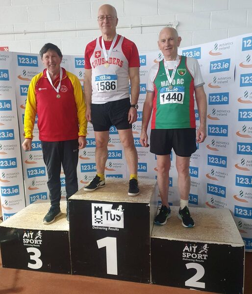 Mayo AC's Patrick Moran, far right, runner-up in the men's M65 long jump, with third placed Seamus Fox, Fanahan McSweeney AC, and winner Liam Lyster, Crusaders AC. Mayo AC's Patrick Moran, far right, runner-up in the men's M65 long jump, with third placed Seamus Fox, Fanahan McSweeney AC, and winner Liam Lyster, Crusaders AC.