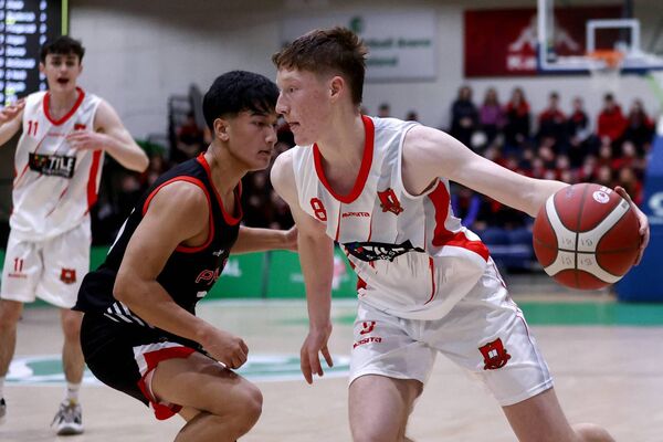 Nathan Roddy of St Muredach's College takes on his opponent Jeremy Hia of Pres De La Salle Bagnalstown.