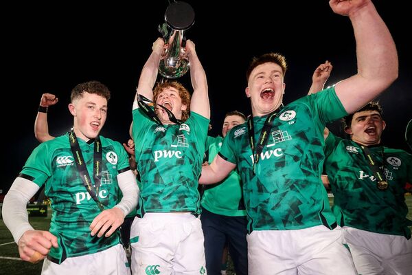 Ireland's Harry West, Henry McErlean and Fiachna Barrett celebrate with the U20 Six Nations trophy. Picture: INPHO/Ben Brady