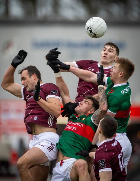 Galway's Matthew Tierney and John Maher contest possession with Mayo's David McBrien and Jordan Flynn. Galway's Matthew Tierney and John Maher contest possession with Mayo's David McBrien and Jordan Flynn.