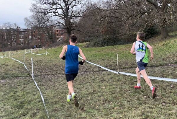 Moy Valley's Eoghan Gallagher, on the right, competing in the under 15 boys event on the Parliament Hill course in the London Cross Country Challenge. 