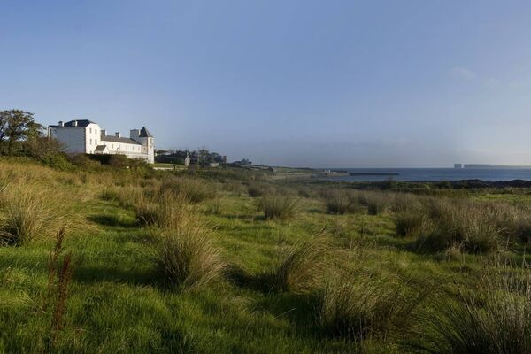 A panoramic view of Stella Maris with Downpatrick Head in the distance.