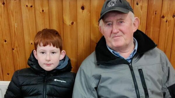 Seamus Nevin and his grandson selling potatoes at the Ballyglass market. The popular market is due to return again in March after alterations to the centre.
