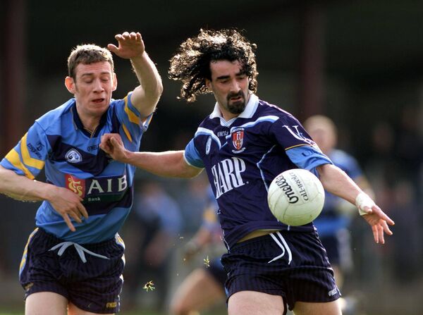 Easkey native Noel McGuire of UCD challenges Jim McGuinness of Ulster University Jordanstown during the 2001 Sigerson Cup final. The same two universities will contest the final this week.	Picture: INPHO/Tom Honan