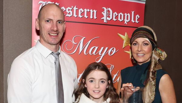 Community Award recipient Rita Casey from Charlestown pictured with husband John and daughter Jenna Eve at Friday night's Mayo Sports Stars Awards. Picture: Michael Donnelly Community Award recipient Rita Casey from Charlestown pictured with husband John and daughter Jenna Eve at Friday night's Mayo Sports Stars Awards. Picture: Michael Donnelly