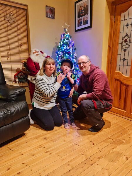 James Ryan with his parents Geraldine and Derek. 