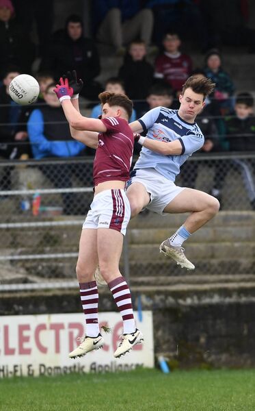 High Jump: St. Gerald’s Dara Neary contests the ball at midfield with Eoin Donaghy, Omagh CBS. Picture: David Farrell Photography 