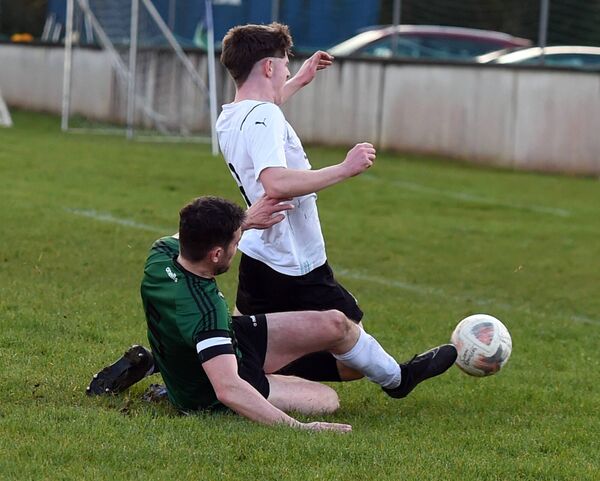  Conn Rangers’ Owen McNamara slide tackles Ballyheane’s Ryan Meldrum