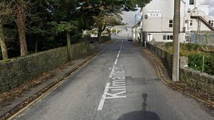 Woman was almost struck when car mounted footpath Woman was almost struck when car mounted footpath