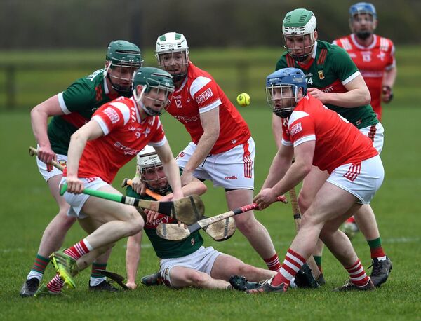 Mayo midfielder John Heraty slips to the ground as he is surrounded by Louth players. Picture: David Farrell Photography