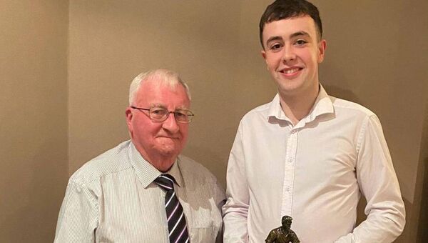 Marty Horkan presenting Ruairi Cullen with the Young Player of the Year Award at the recent Charlestown Sarsfields annual dinner dance held in the Yeats County Inn Curry recently Marty Horkan presenting Ruairi Cullen with the Young Player of the Year Award at the recent Charlestown Sarsfields annual dinner dance held in the Yeats County Inn Curry recently