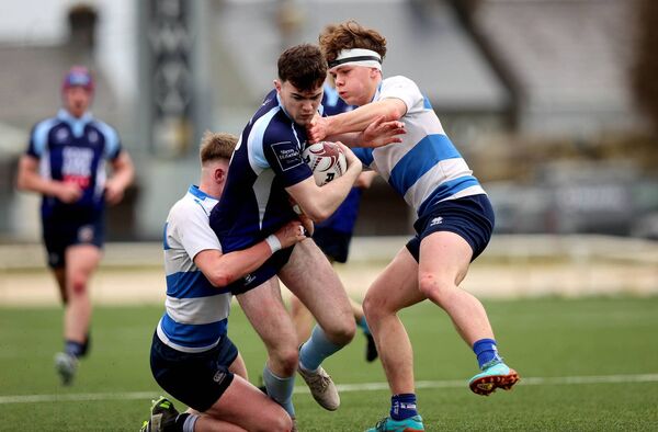 John O’Brien of St Gerald's is tackled by Darragh O’Connor and Harry Grimes of Rice College. John O’Brien of St Gerald's is tackled by Darragh O’Connor and Harry Grimes of Rice College.