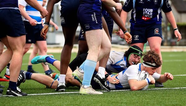 Tom Ginnelly scores a try for Rice College. Tom Ginnelly scores a try for Rice College.
