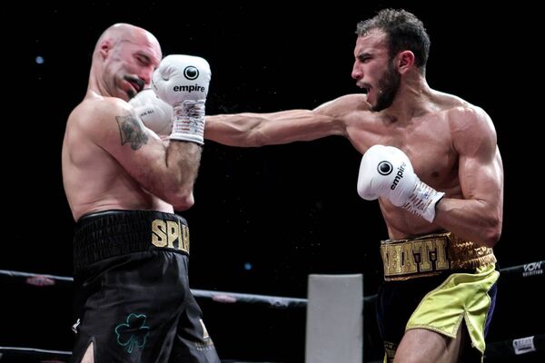 Sofiane Khati lands a big hit to 'Spike' O'Sullivan during their middleweight fight. INPHO/Laszlo Geczo