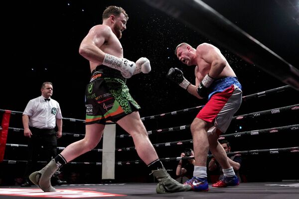 Heavyweight Pavel Sour is knocked down for the first time by Thomas 'The Bomber' Carty. INPHO/Laszlo Geczo
