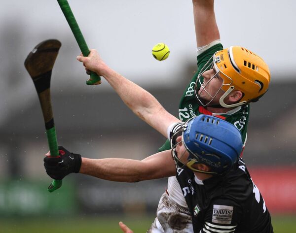Mayo’s Cormac Phillips and Sligo’s James Weir contest the dropping sliothar. Mayo’s Cormac Phillips and Sligo’s James Weir contest the dropping sliothar.