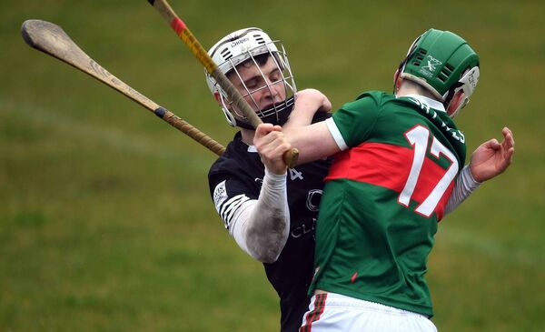 Mayo’s Matthew Connor has his path blocked by Sligo’s Niall Kilcullen. Mayo’s Matthew Connor has his path blocked by Sligo’s Niall Kilcullen.