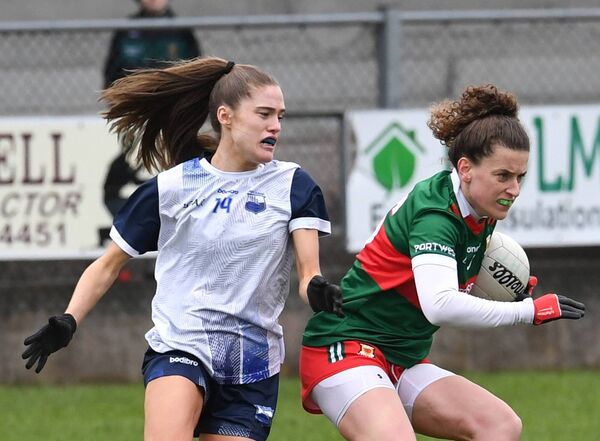 Mayo’s Kathryn Sullivan holds onto the ball despite the close marking of Waterford’s Katie Murray during the Lidl Ladies NFL Division 1 tie at James Stephens Park, Ballina, last Sunday. Picture: David Farrell Photography 