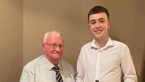 Niall Towey receiving the Junior Player of the Year Award from Marty Horkan at the Sarsfields Annual Dinner Dance in the Yeats County Inn Curry Niall Towey receiving the Junior Player of the Year Award from Marty Horkan at the Sarsfields Annual Dinner Dance in the Yeats County Inn Curry