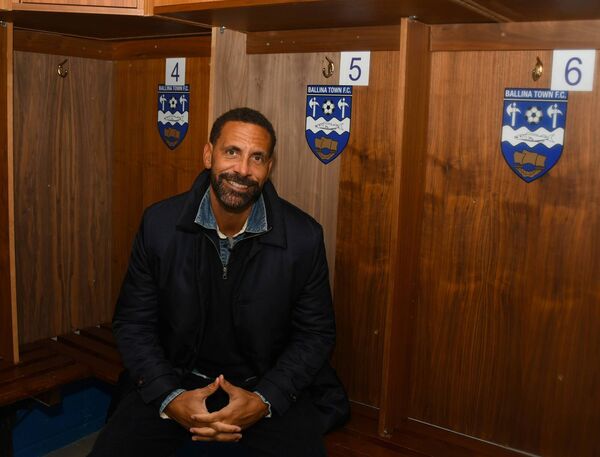 Rio Ferdinand sits beside the number he made famous during his 12 years playing with the all-conquering Manchester United team, upon his visit to the home of Ballina Town FC last week. Picture: John O'Grady Rio Ferdinand sits beside the number he made famous during his 12 years playing with the all-conquering Manchester United team, upon his visit to the home of Ballina Town FC last week. Picture: John O'Grady