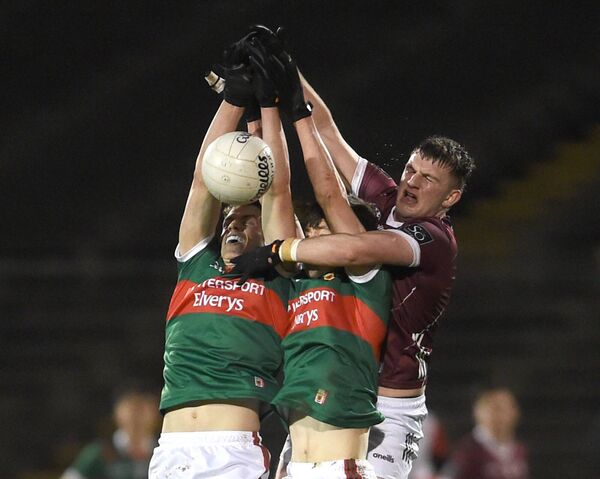 Mayo midfielders Diarmuid Duffy and Conal Dawson are tightly marked by Galway’s Daithí Kilcommins. Mayo midfielders Diarmuid Duffy and Conal Dawson are tightly marked by Galway’s Daithí Kilcommins.