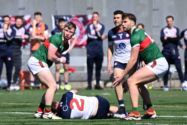 Mayo's Ryan O'Donoghue and Aidan O'Shea converge on New York's Shane Bolger. Mayo's Ryan O'Donoghue and Aidan O'Shea converge on New York's Shane Bolger.