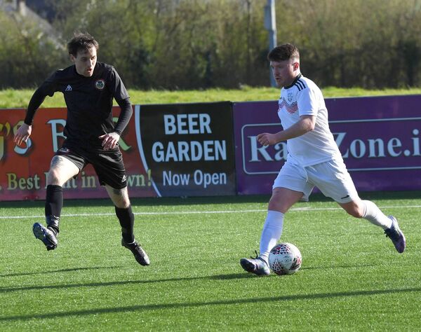 Mayo’s Jason Hunt sets up an attack as Sligo/Leitrim’s Mark Hannon challenges for the ball. Picture: David Farrell Photography Mayo’s Jason Hunt sets up an attack as Sligo/Leitrim’s Mark Hannon challenges for the ball. Picture: David Farrell Photography