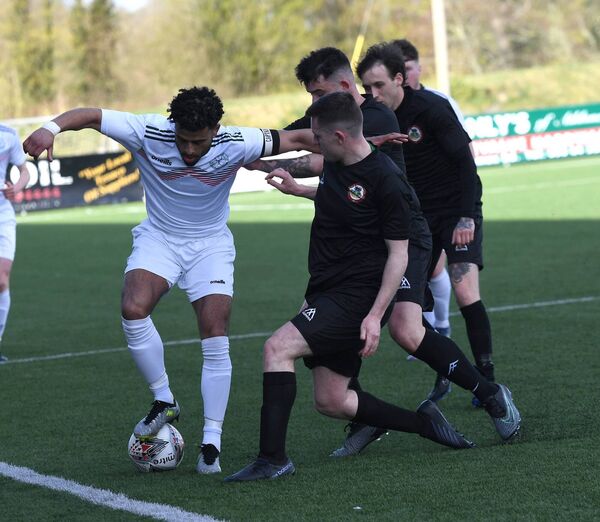 Mayo’s Jordan Loftus traps and shields the ball from three Sligo/Leitrim opponents. Picture: David Farrell Photography Mayo’s Jordan Loftus traps and shields the ball from three Sligo/Leitrim opponents. Picture: David Farrell Photography