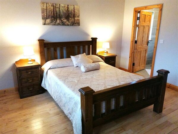 A bedroom and ensuite at the stunning home